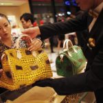 File photo of a woman shopping in a Louis Vuitton store in downtown Shanghai